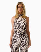 GUESS Halter Neck Jumpsuit in zebra print halter neckline detail