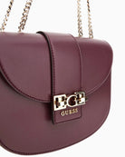 Side view of GUESS Jane shoulder bag showing smooth finish