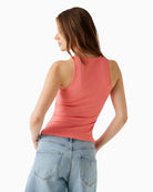 Back of pink Guess tank showing smooth rib knit texture
