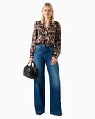 Woman wearing Guess animal print chiffon blouse brown – Áines Boutique