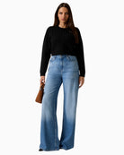 Ribbed hem and cuffs on cropped Guess knit for added comfort