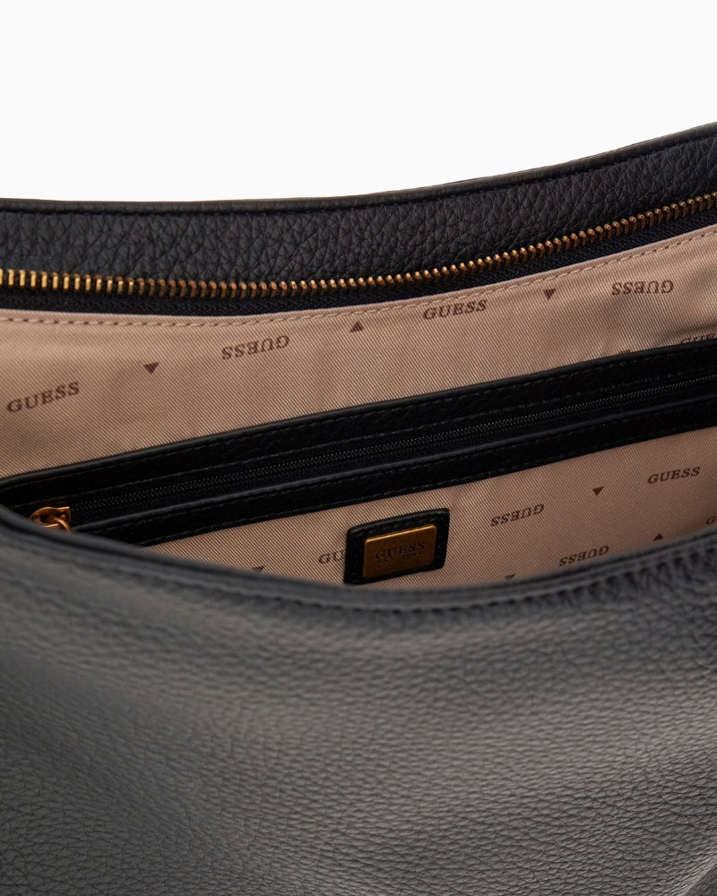 Interior of Guess Camden shoulder bag with logo lining and internal zip pocket
