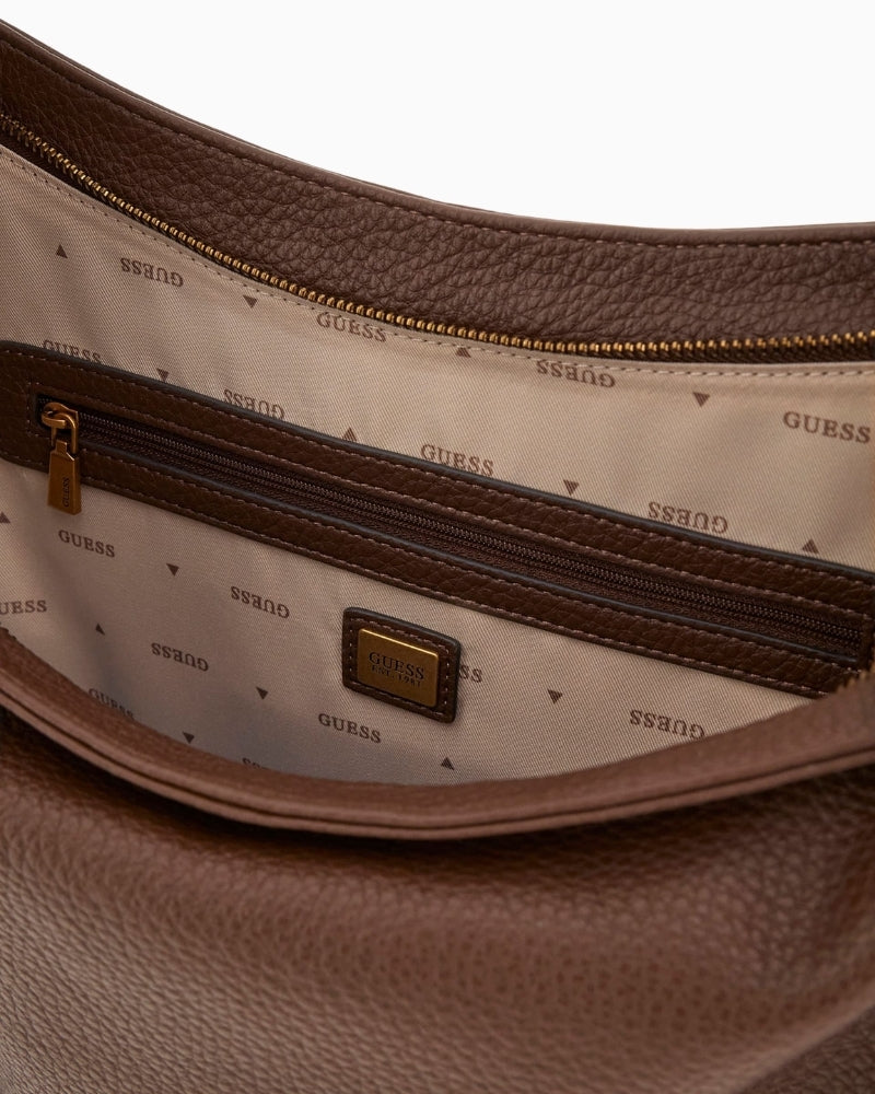Interior of Guess Camden shoulder bag with Guess logo lining and zip pocket