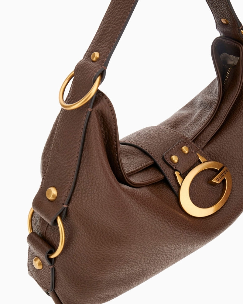 Close-up of gold hardware and Guess script logo on brown Camden shoulder bag