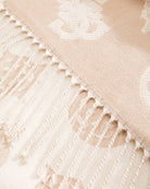 Close-up of beige Guess scarf showing delicate lurex thread