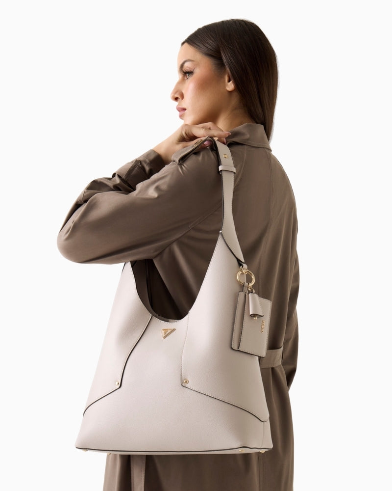 Woman wearing Guess Darcy hobo bag stone  – Áines Boutique