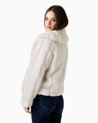 Side view showing long sleeves and plush striped faux fur fabric