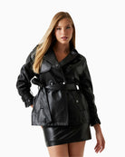 Front view of GUESS faux leather trench coat in black with sash belt and snap closure