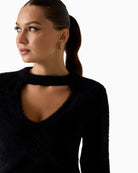 Close-up of neckline cut-out on Guess fuzzy sweater with ribbed trim