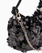 Side view of Holiday Shine bag showing rhinestone handle and compact size