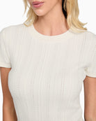 Close-up of soft textured knit fabric on GUESS Marcie sweater top