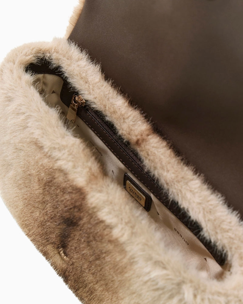 Interior view of Guess Mavis bag showing logo lining and spacious size