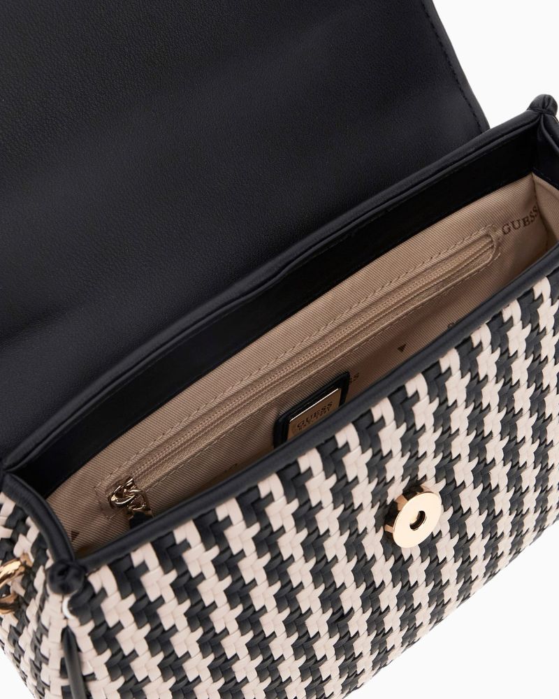 Interior of mini bag with logo lining and inner zip pocket

