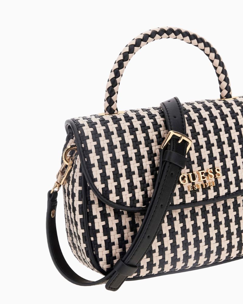 Side view of compact Guess bag showing structured shape and charm detail