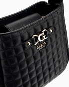 Close-up view of compact faux leather Guess bag with adjustable strap