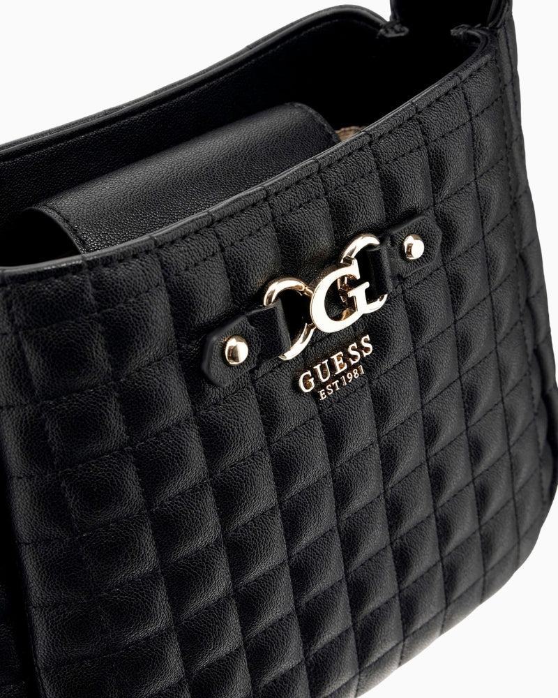 Close-up view of compact faux leather Guess bag with adjustable strap