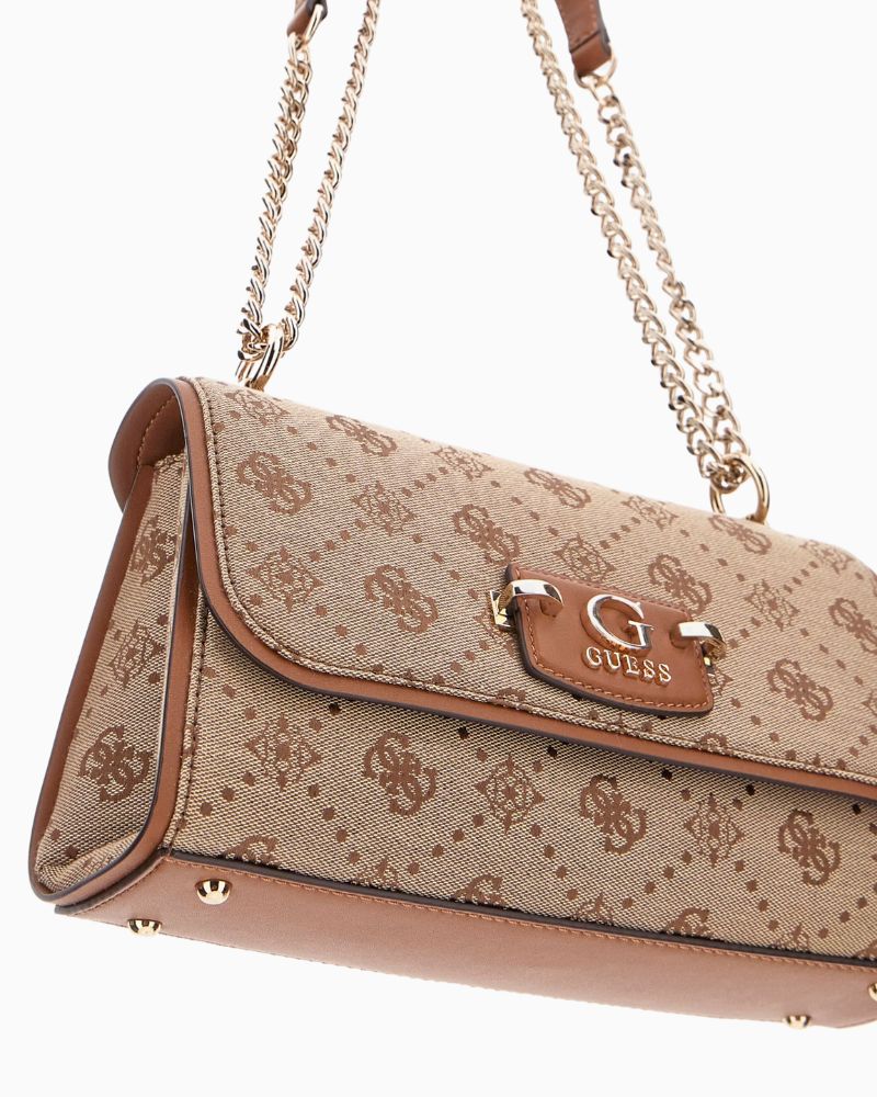 Close-up of front flap with pale gold metal Guess logo and button fastening