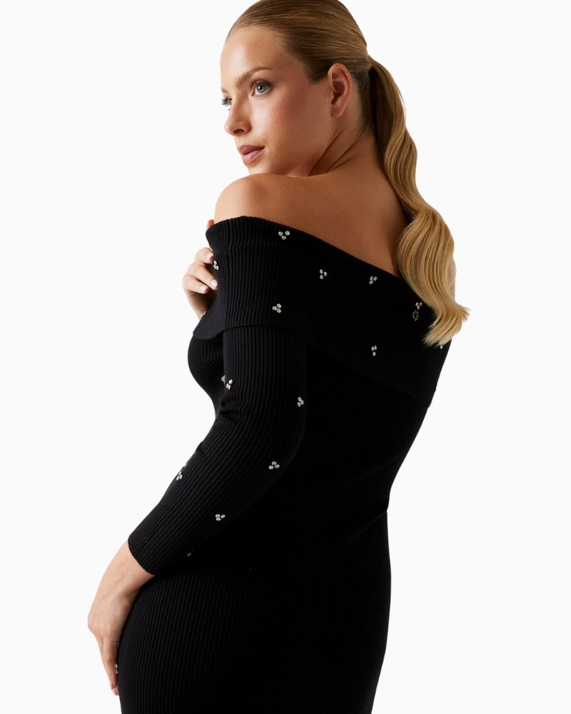 Close-up of rhinestone embellishments on soft viscose blend fabric