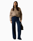 Woman wearing Guess satin bomber jacket brown – Áines Boutique