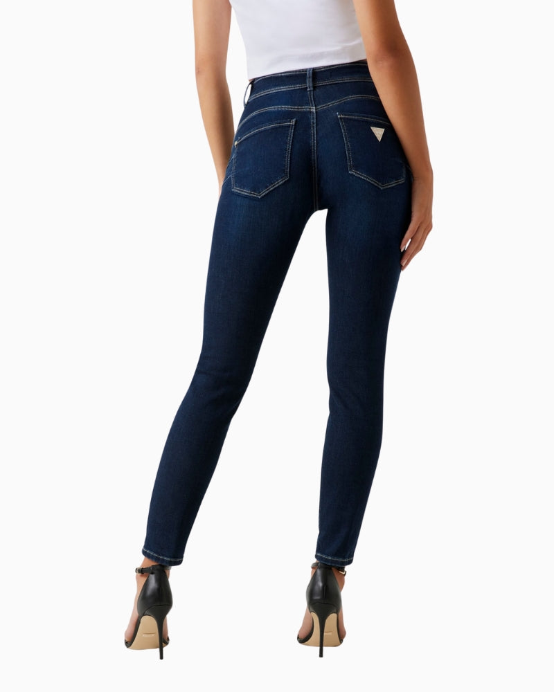Back of Guess skinny jeans showing shaping fit and dark denim tone