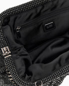 Interior view of Guess clutch with zip pocket and fabric lining