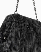 Close-up of rhinestone mesh texture and silver hardware detail