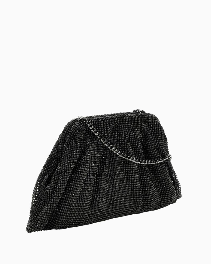 Side view of clutch showing spacious interior and detachable chain strap
