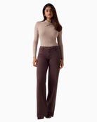 Guess asymmetric neck sweater paired with jeans – Áines Boutique