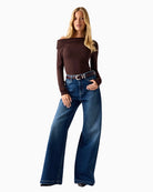 woman wearing Guess one-shoulder top brown front view – Áines Boutique