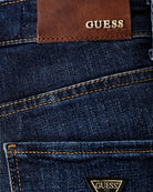 Guess Sexy Straight Jeans in Dark Denim logo patch detail