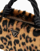 Top view of Guess handbag showing button closure and gold detailing