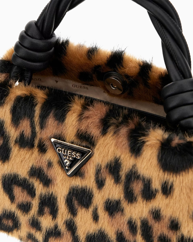 Top view of Guess handbag showing button closure and gold detailing