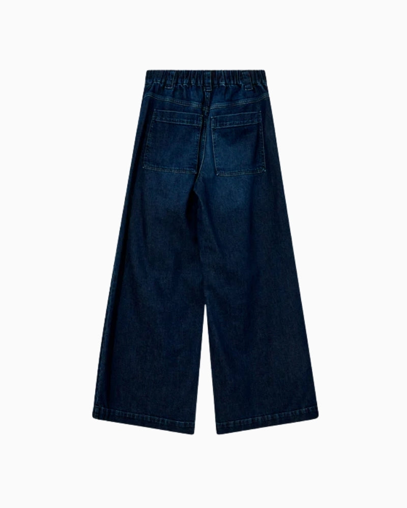 Back view of wide-leg jeans showing relaxed fit and cropped length