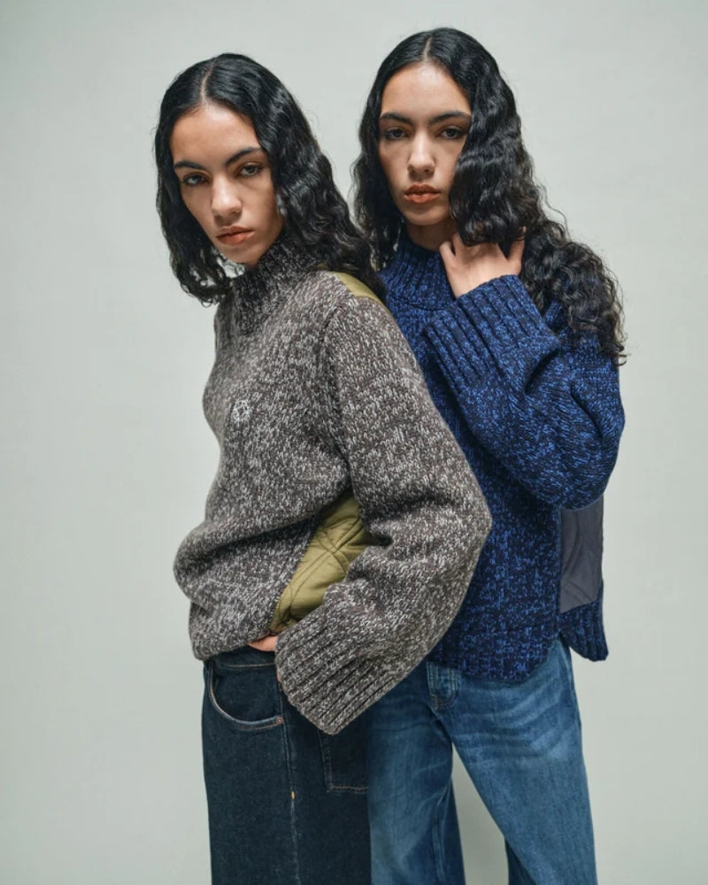 Front view of high neck HEYANNO knit with subtle logo on chest