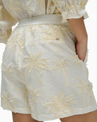 High waist white embroidered shorts back view with elastic detail