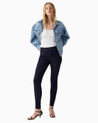Model view Levi’s 721 high rise skinny jeans in blue stretch denim with zip fly and 5-pocket design