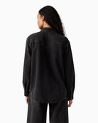 Back view of Levi’s denim shirt showing western yoke and relaxed fit