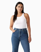 Woman wearing Levi’s Essential Racer tank top white, front view – Áines Boutique