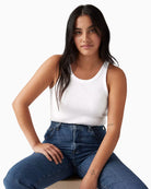 Woman wearing Levi’s Essential Racer tank top white, paired with jeans – Áines Boutique