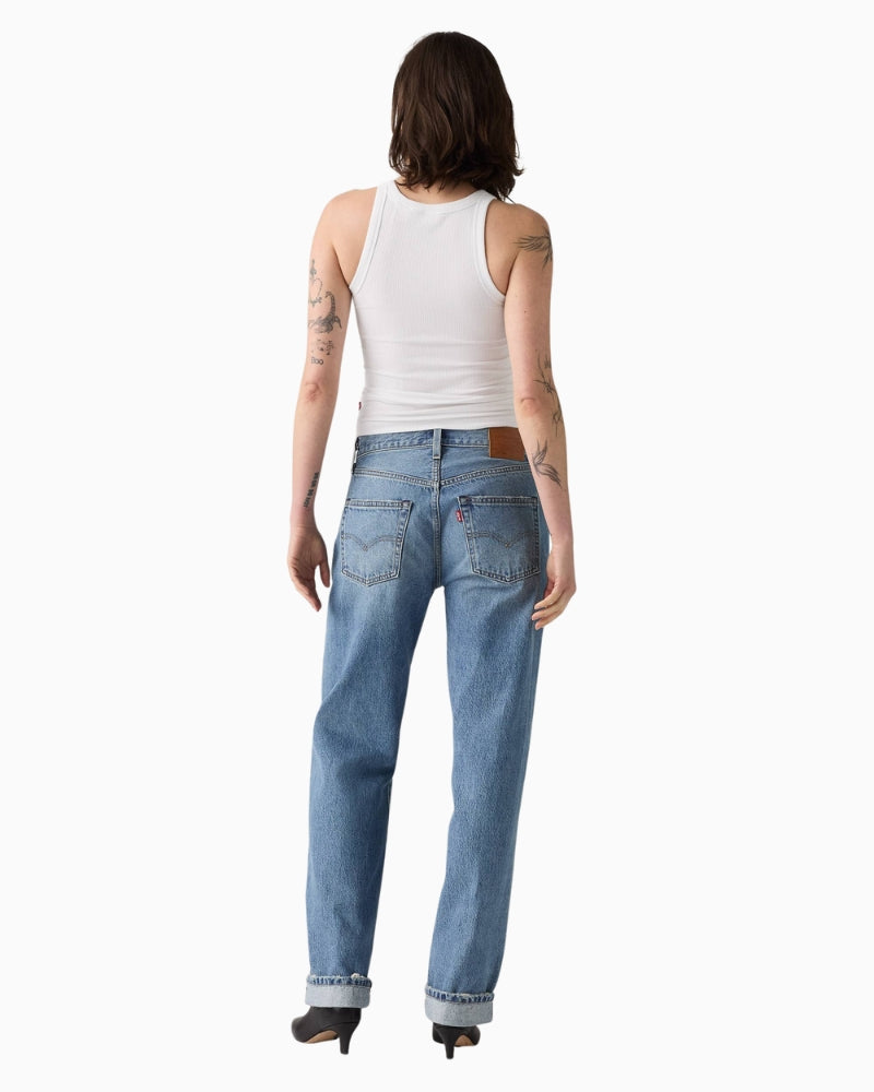 Back view of Levi’s straight-leg selvedge jeans showing classic 5-pocket style and leather patch branding