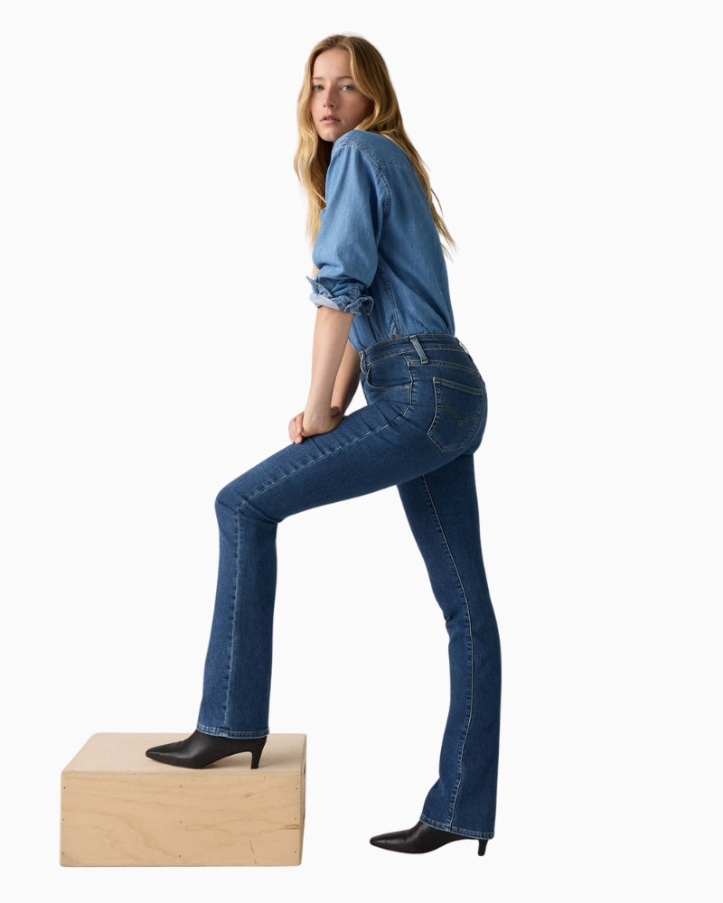 Side angle showing flattering shape and modern bootcut hem on Levi’s 725 jeans