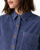 Close-up of corduroy fabric and button fastening on Levi’s Celine Cozy Shacket