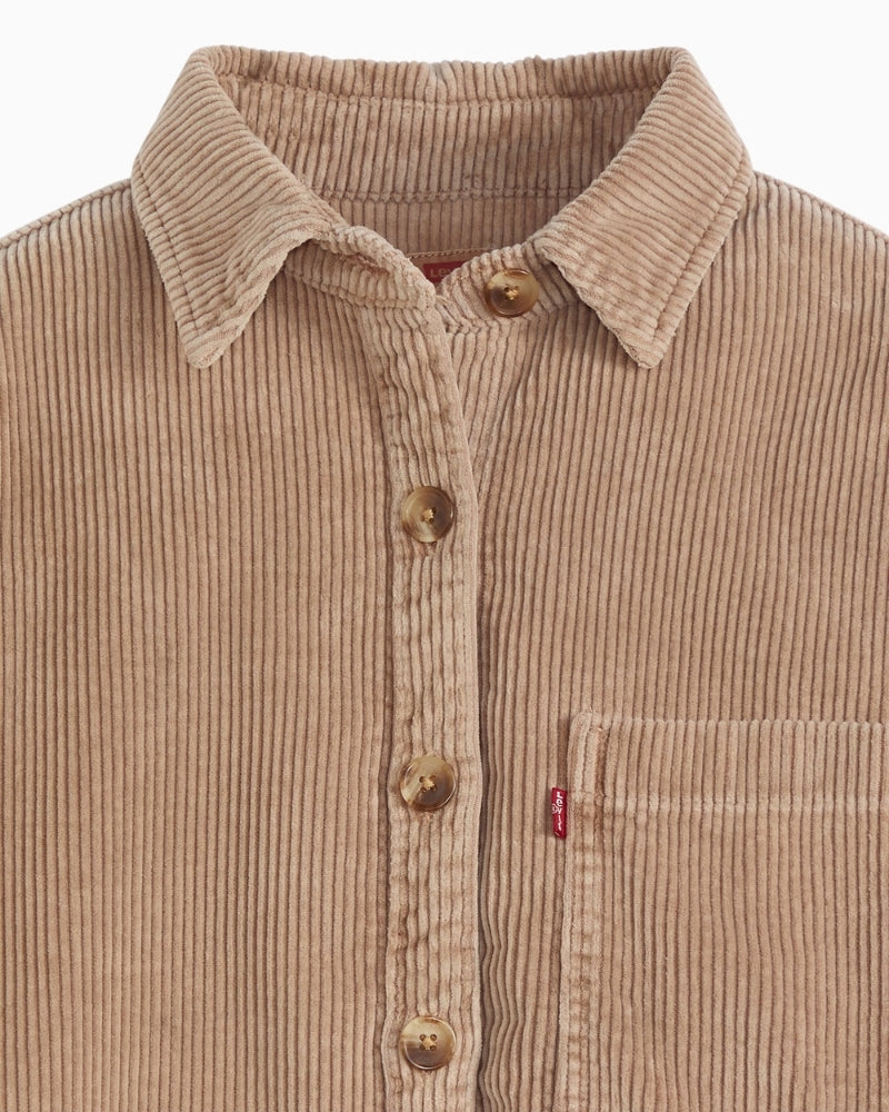 Close-up of corduroy texture and button fastening on Levi’s shacket