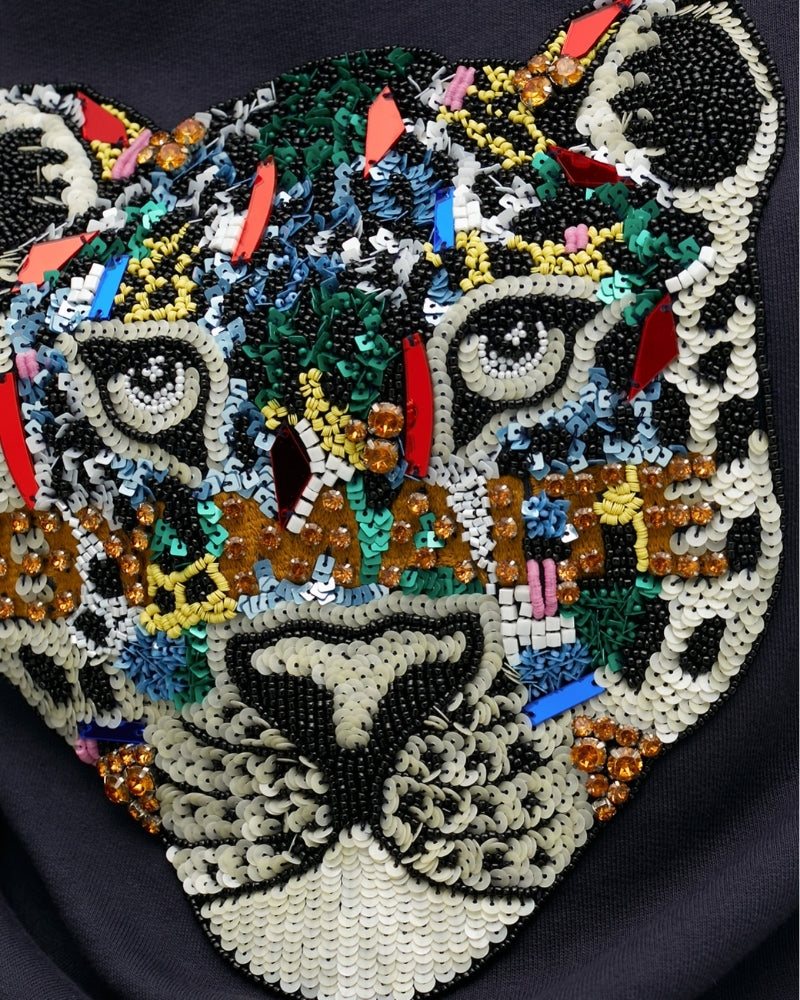 Close-up of rhinestone accents on Lola Casademunt cotton top
