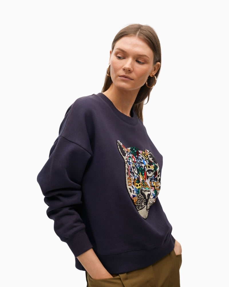 Front view of long-sleeve sweatshirt with striking motif and embellishment