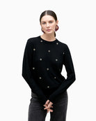 Black merino blend knit sweater by Lola Casademunt with jewel embellishment