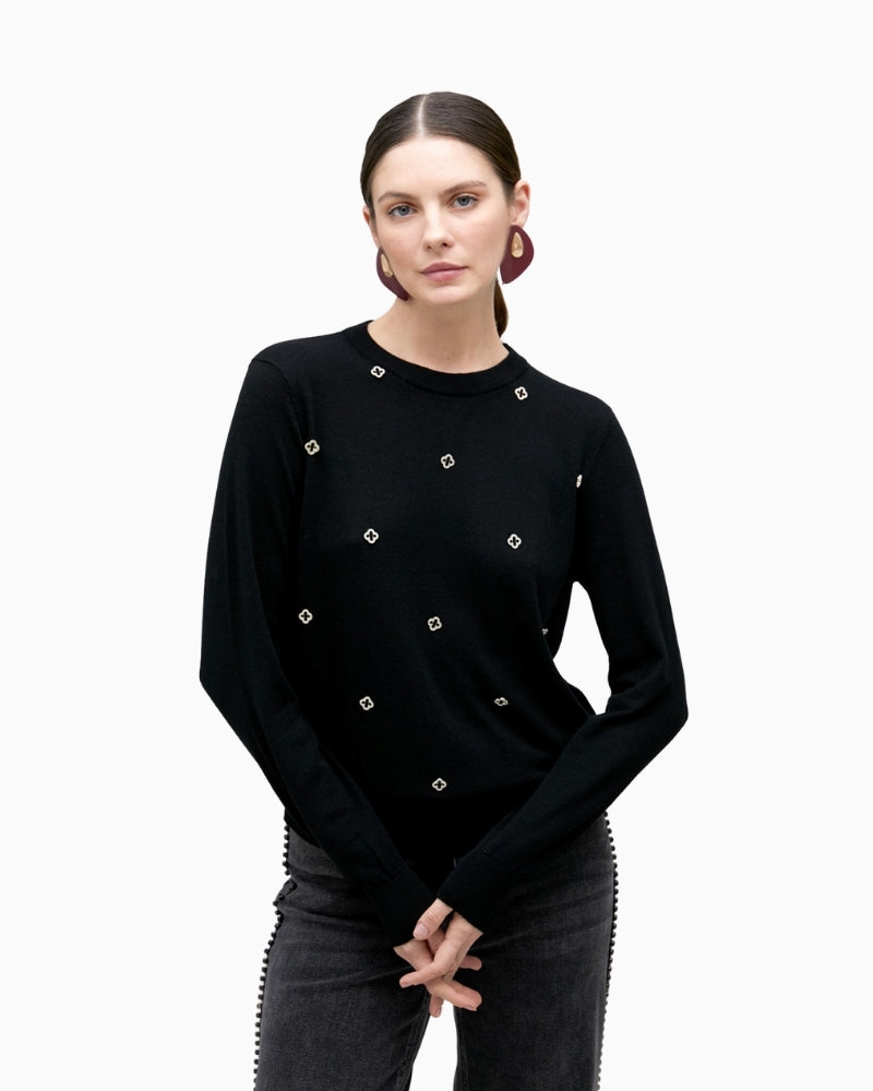 Black merino blend knit sweater by Lola Casademunt with jewel embellishment