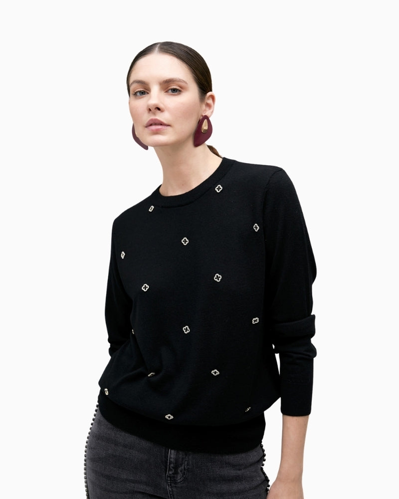 Black merino blend knit sweater by Lola Casademunt with jewel embellishment