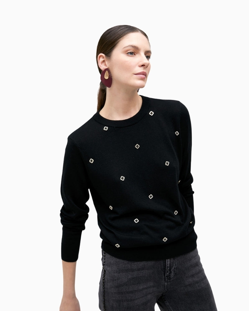 Front view of long-sleeve sweater with subtle sparkle at neckline