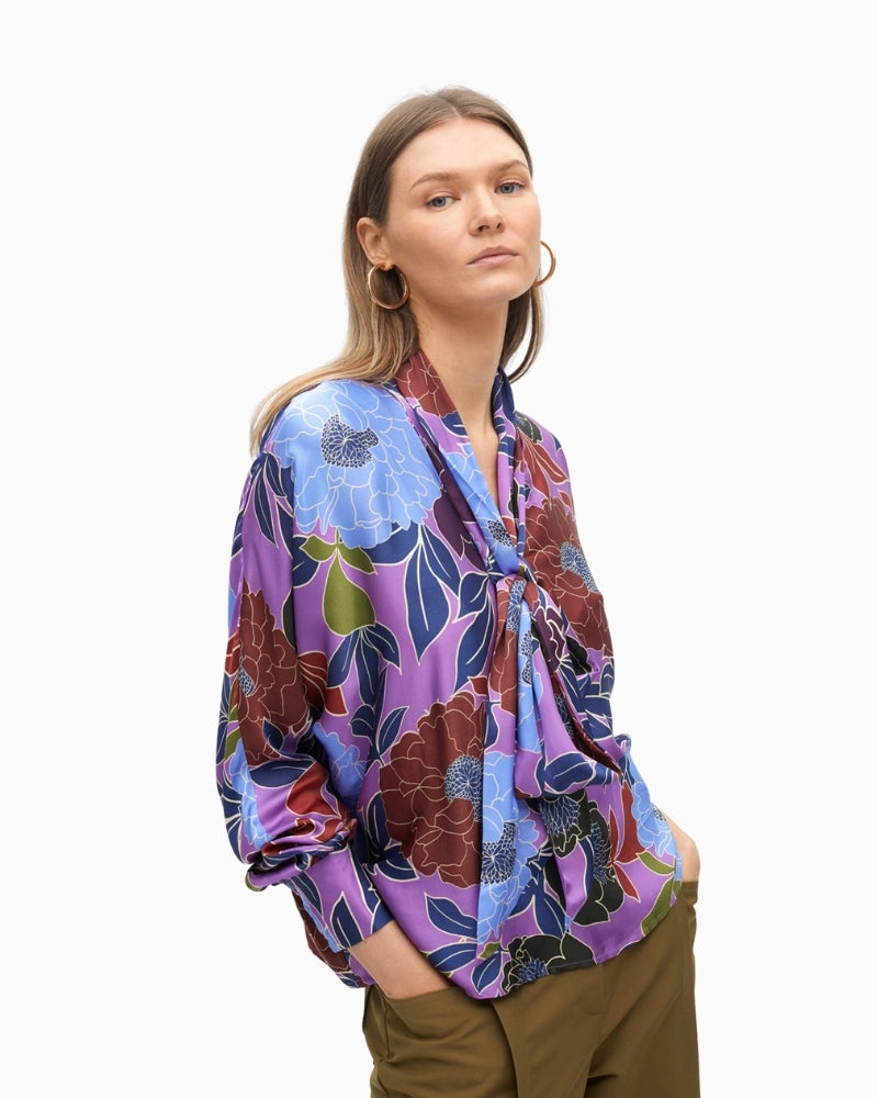 Floral print blouse with tie-neck detail and long sleeves by Lola Casademunt